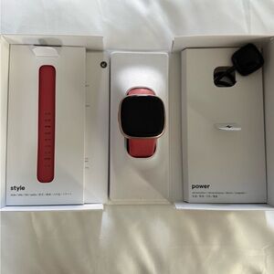 Fitbit Versa 4 -Canyon Rose aluminum case with pink sand infinity bands.